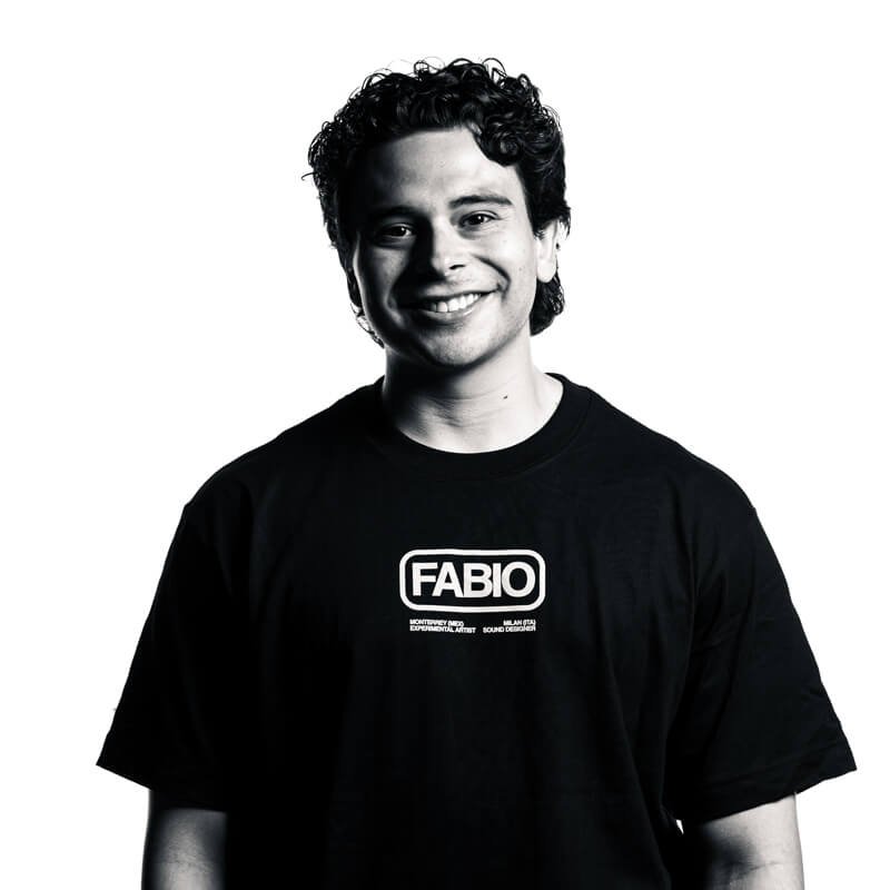 Smiling man in a black T-shirt with a logo